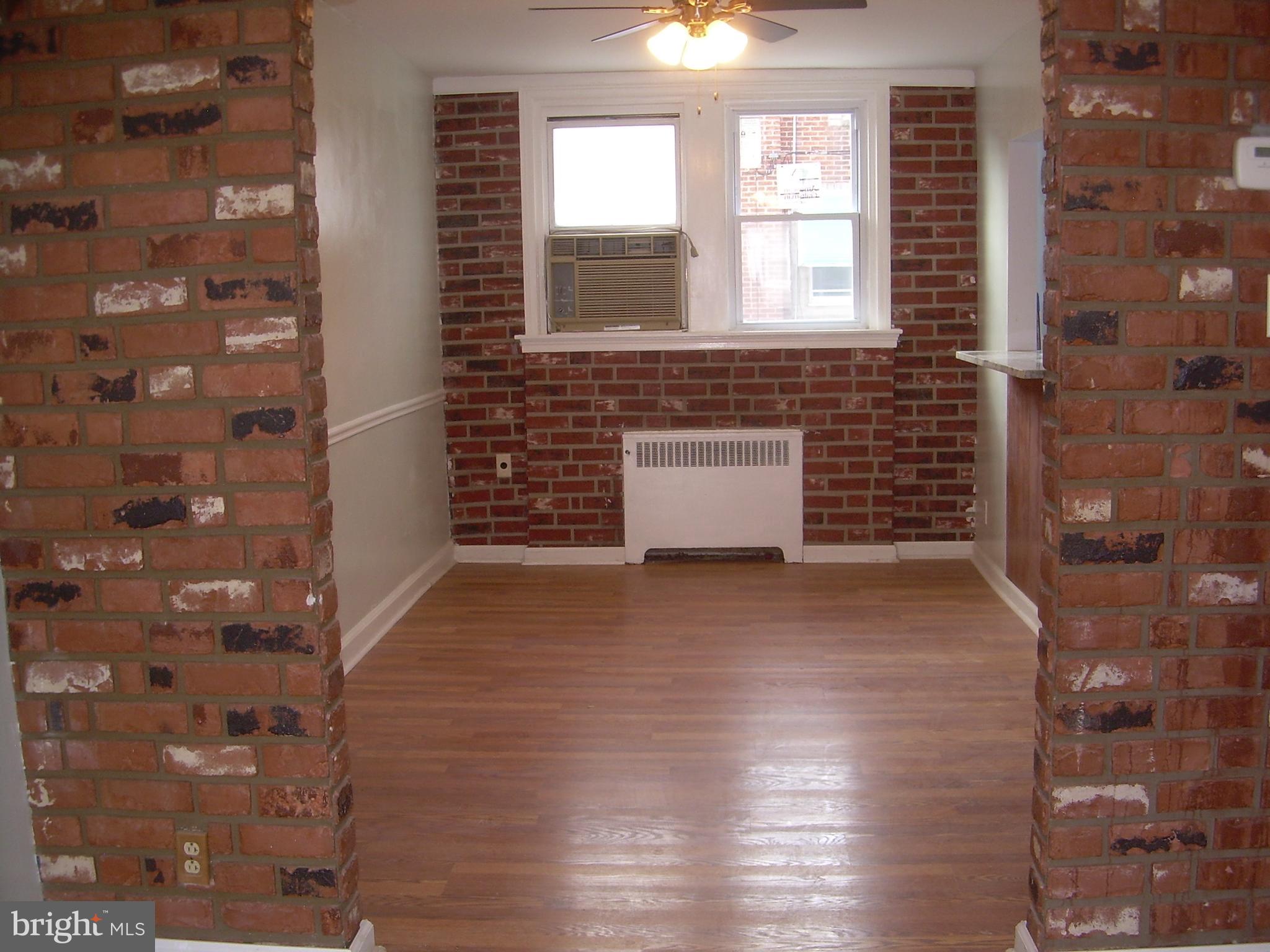 4214 Marple Street Philadelphia, PA 19136 - Photo 5 of 39 a view of a room that has wooden floor and a window