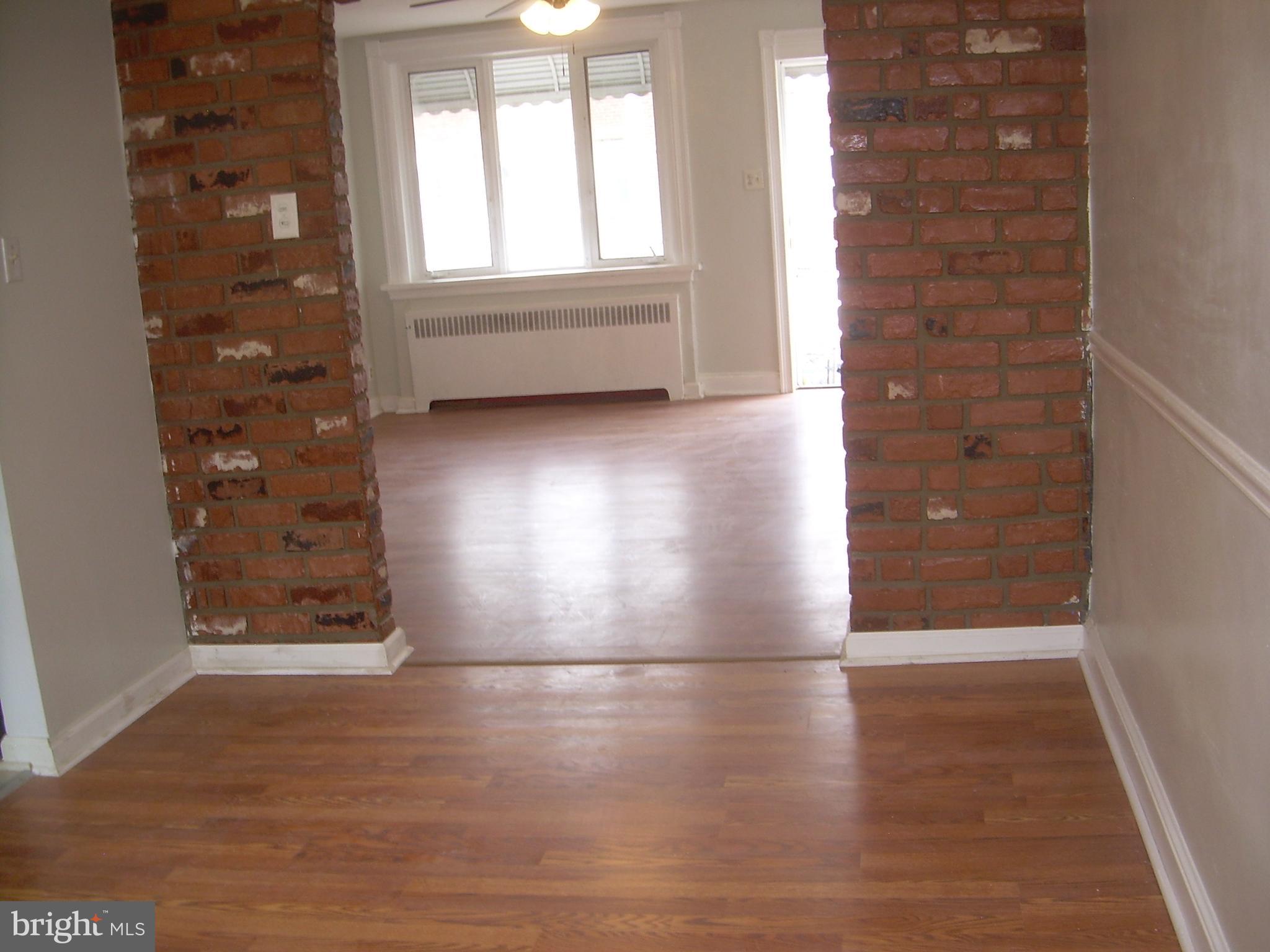 4214 Marple Street Philadelphia, PA 19136 - Photo 6 of 39 an empty room with wooden floor and windows