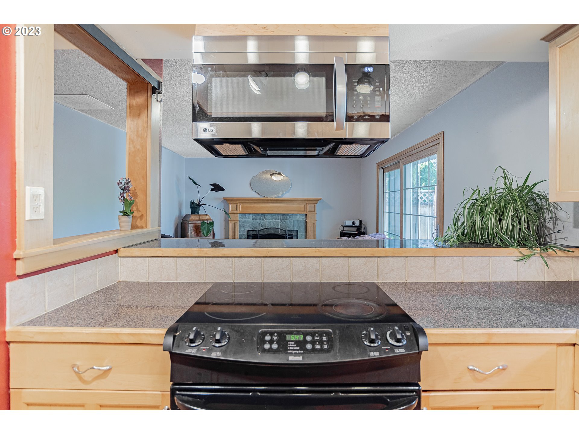 9709 Northwest 19th Avenue Vancouver, WA 98665 - Photo 11 of 27 a kitchen with a stove and cabinets