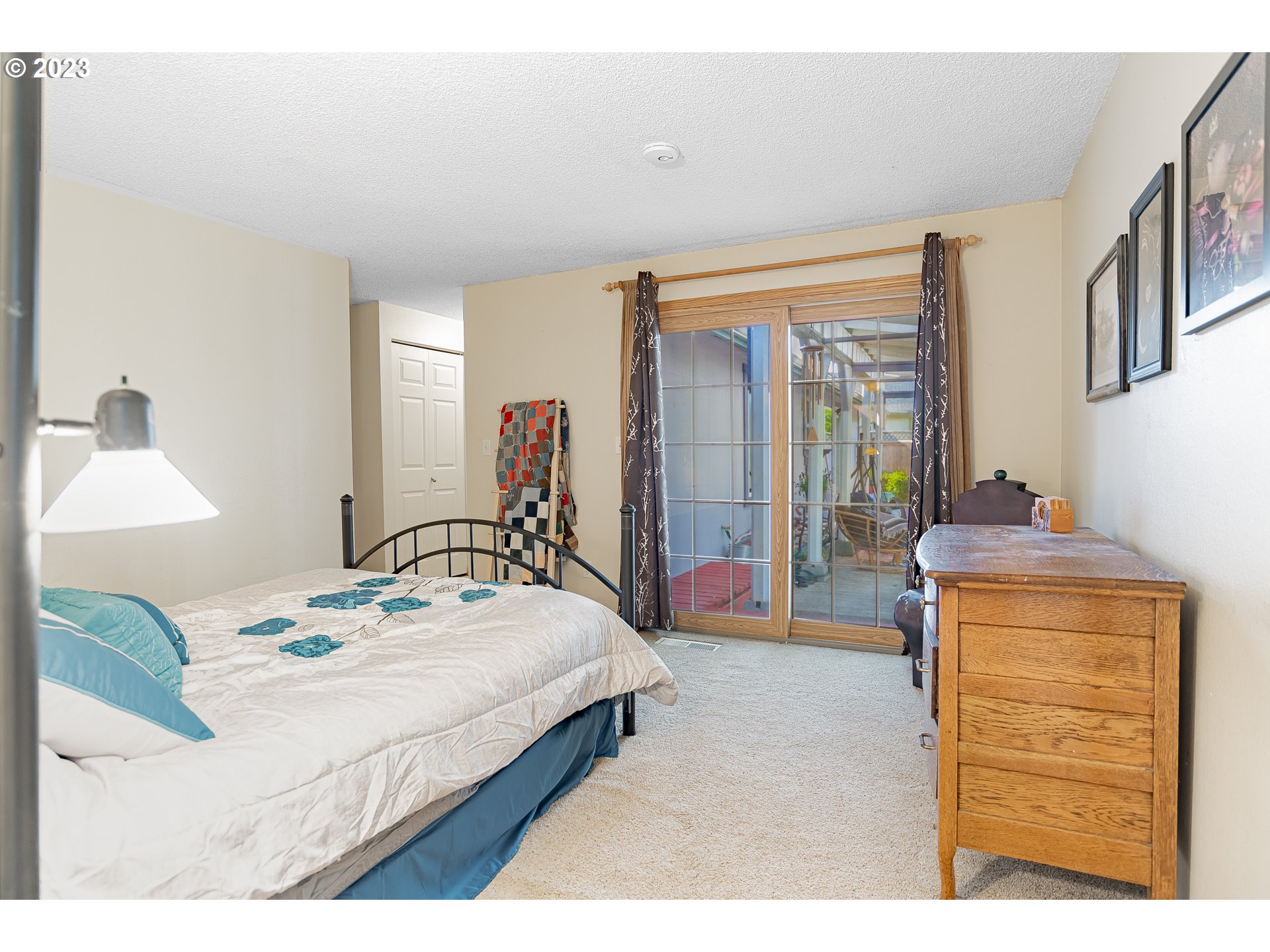 9709 Northwest 19th Avenue Vancouver, WA 98665 - Photo 12 of 27 a bedroom with a bed and a dresser