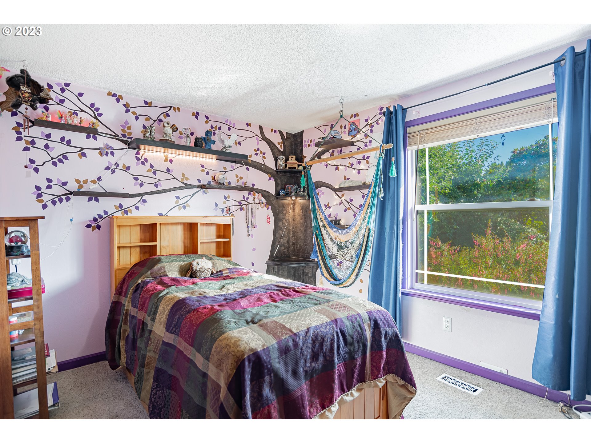 9709 Northwest 19th Avenue Vancouver, WA 98665 - Photo 17 of 27 a bedroom with a bed and a window