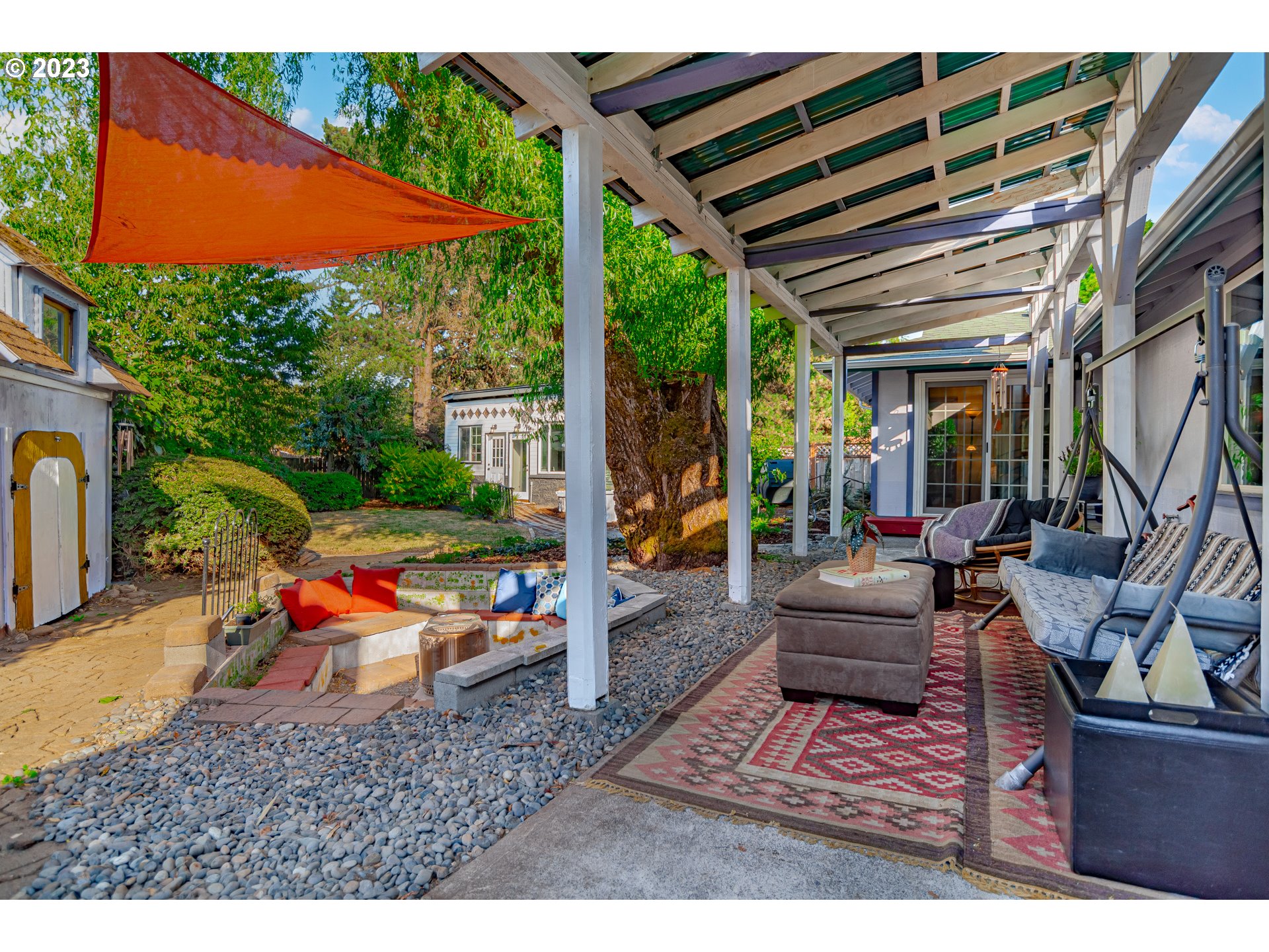 9709 Northwest 19th Avenue Vancouver, WA 98665 - Photo 20 of 27 a backyard of a house with sofas table and chairs