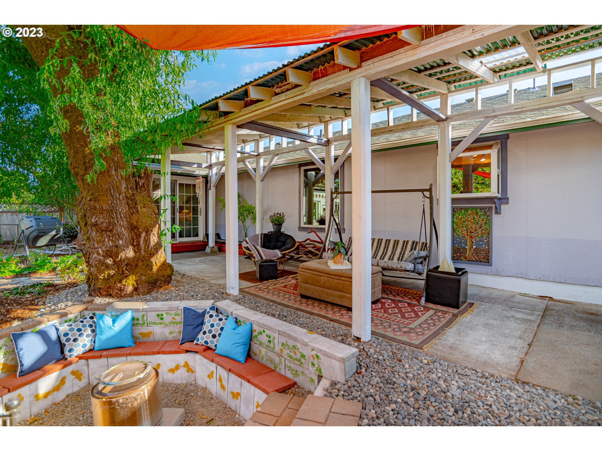 9709 Northwest 19th Avenue Vancouver, WA 98665 - Photo 3 of 27 a view of a patio with table and chairs with wooden floor and fence