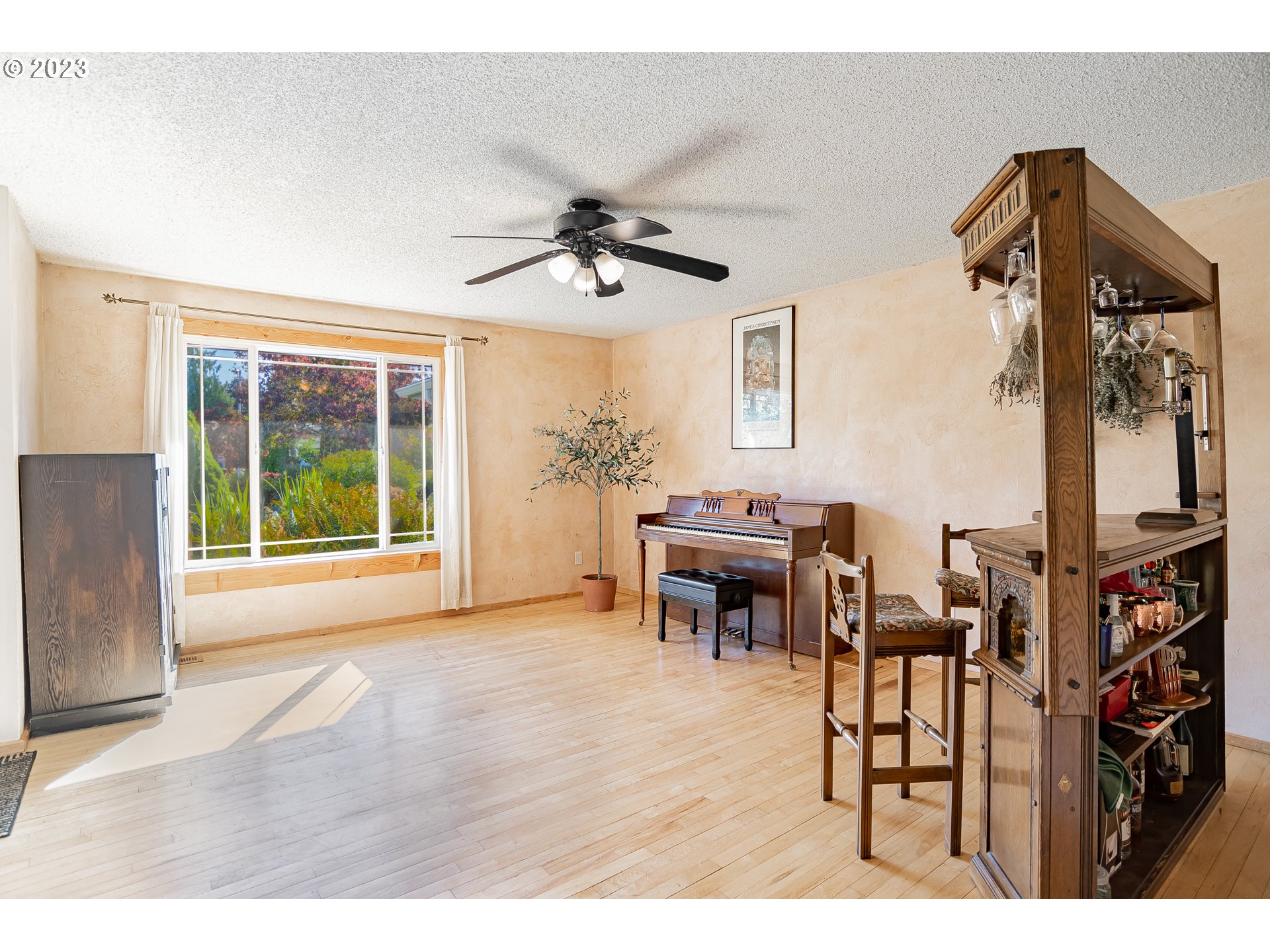 9709 Northwest 19th Avenue Vancouver, WA 98665 - Photo 5 of 27 a living room with furniture a window and a flat screen tv