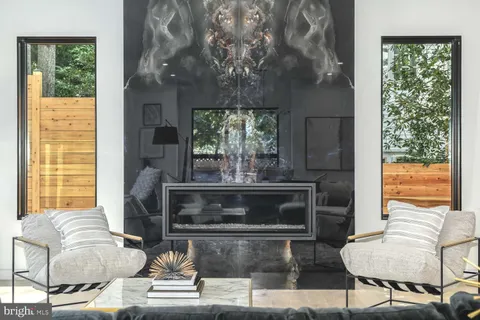 a view of kitchen with kitchen island a sink stainless steel appliances and cabinets