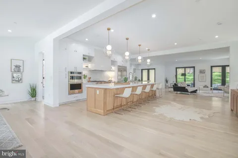 a bedroom with a large bed and a large window