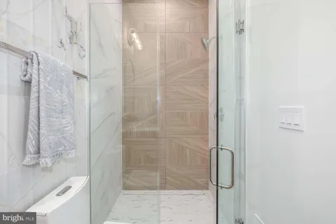 a spacious bathroom with a double vanity sink a mirror and a bathtub