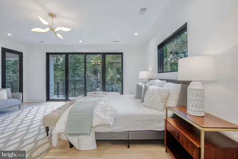 a bathroom with a bathtub and a window
