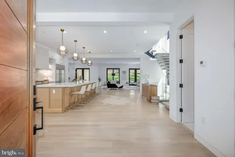a view of kitchen with dining area and windows