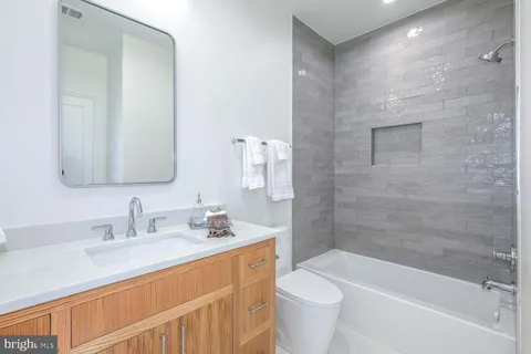 a balcony with furniture and a potted plant