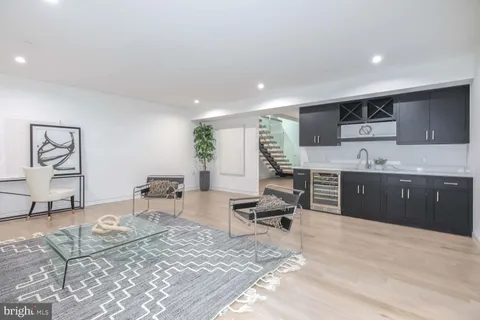 a view of a house with a yard and sitting area