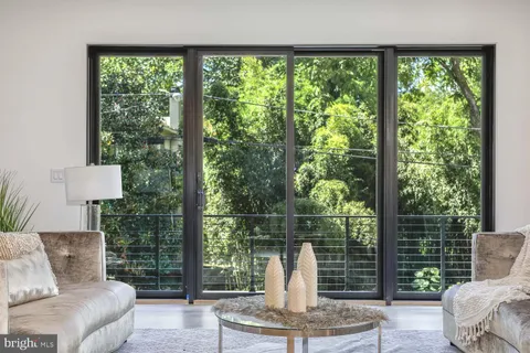 a living room with a couch and a swing