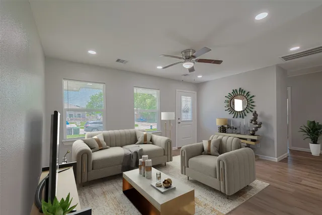 a living room with furniture a chandelier and a window