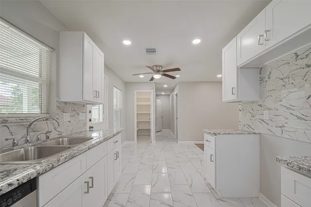 a bathroom with a sink a vanity and a mirror