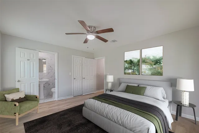 a spacious bedroom with a bed and a window