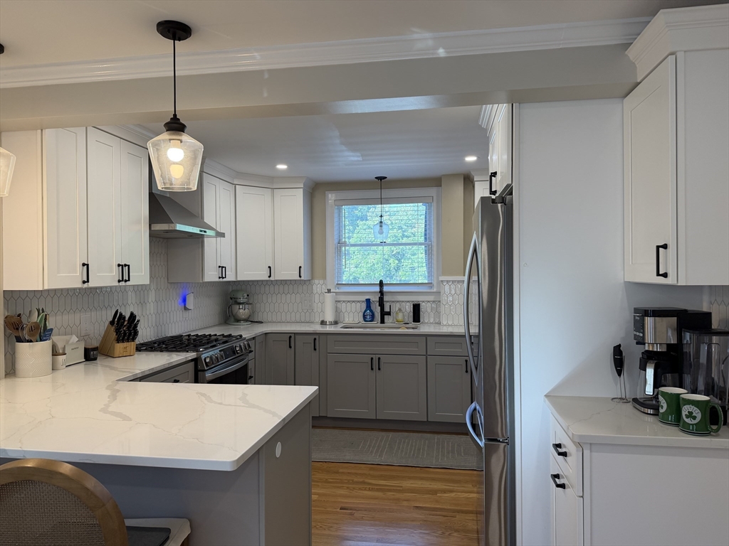 29 Pilgrim Road Weymouth, MA 02191 - Photo 11 of 38 a kitchen that has a lot of cabinets in it
