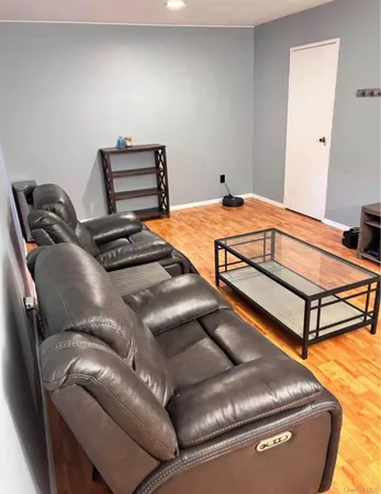 a bedroom with a bed and couch