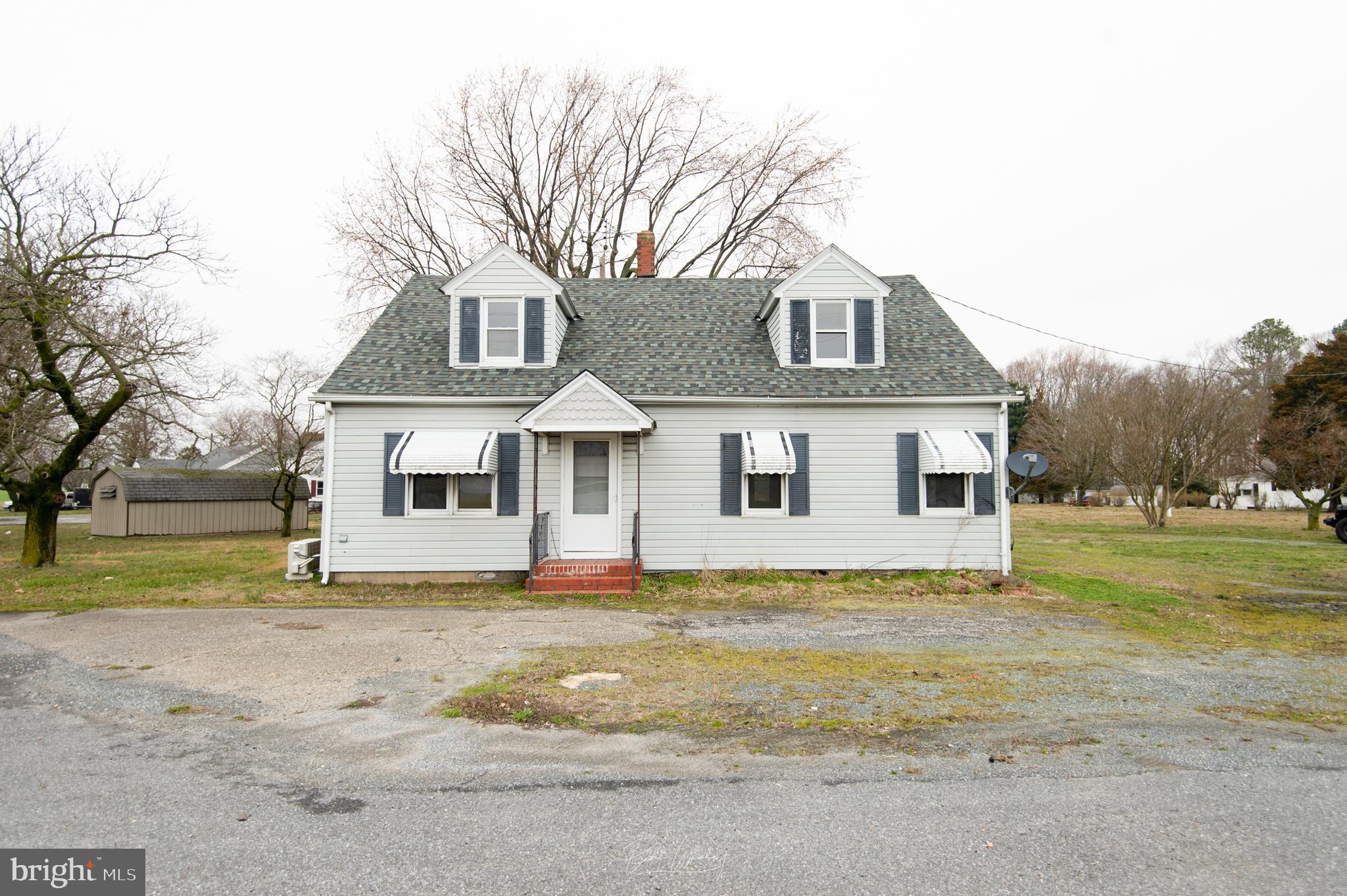 5902 Shiloh Church Hurlock Road Hurlock, MD 21643 - Photo 20 of 21 a front view of a house with a yard