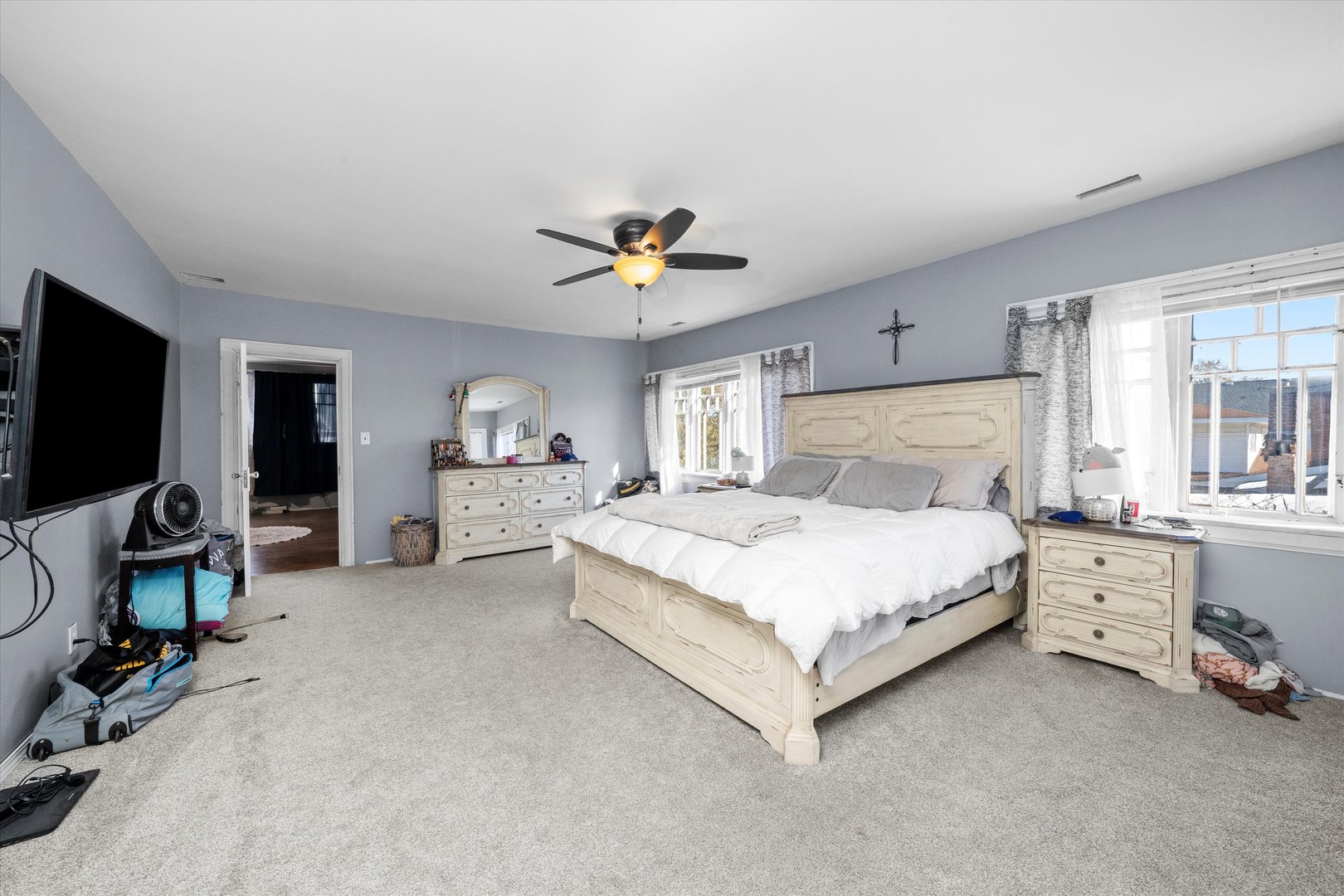 31 East 155th Street Harvey, IL 60426 - Photo 14 of 37 a bedroom with bed and a chandelier