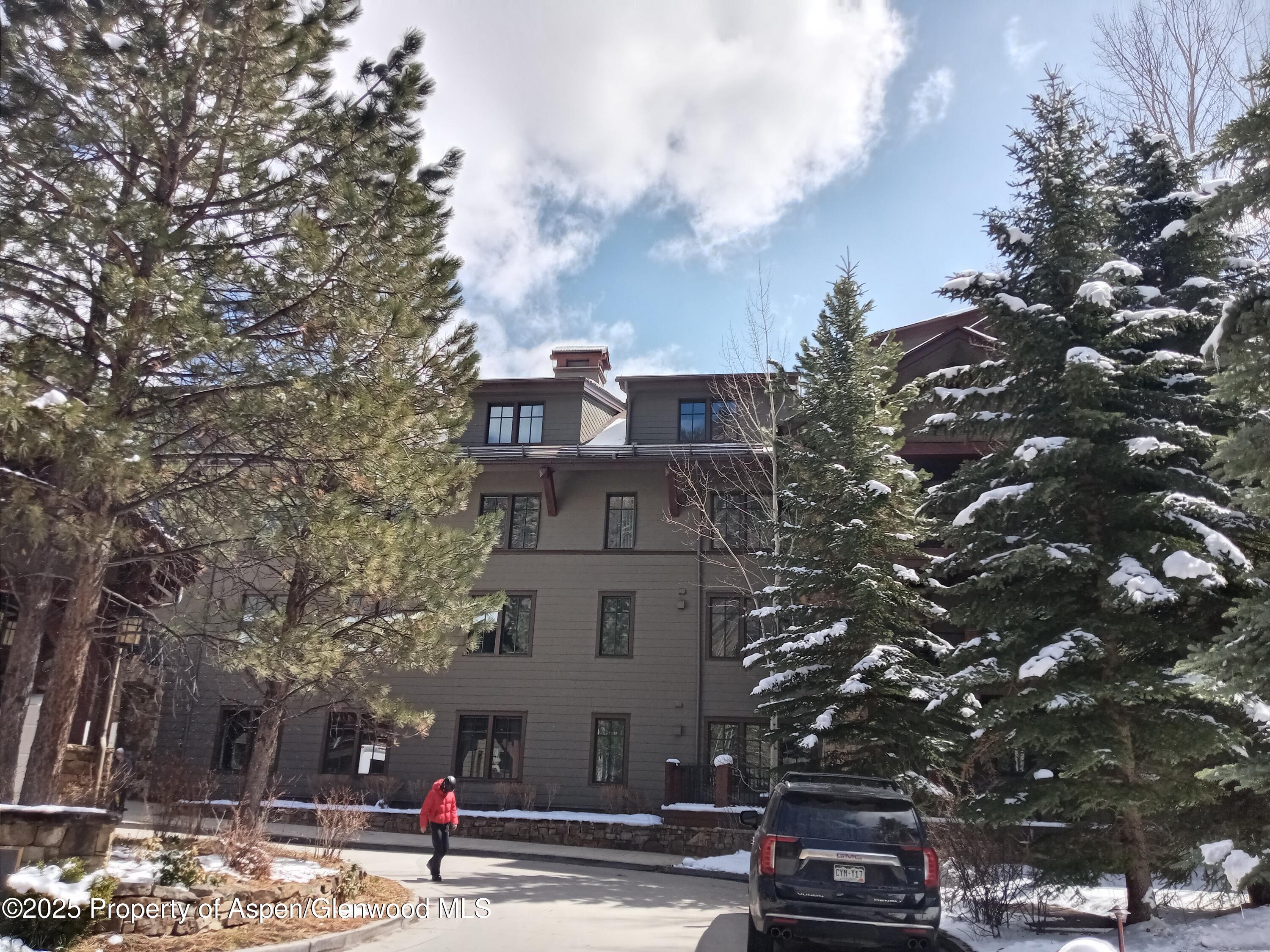 75 Prospector Road, Unit 8204 WINTER INTEREST #5 Aspen, CO 81611 - Photo 35 of 41 a view of a tall building next to a road