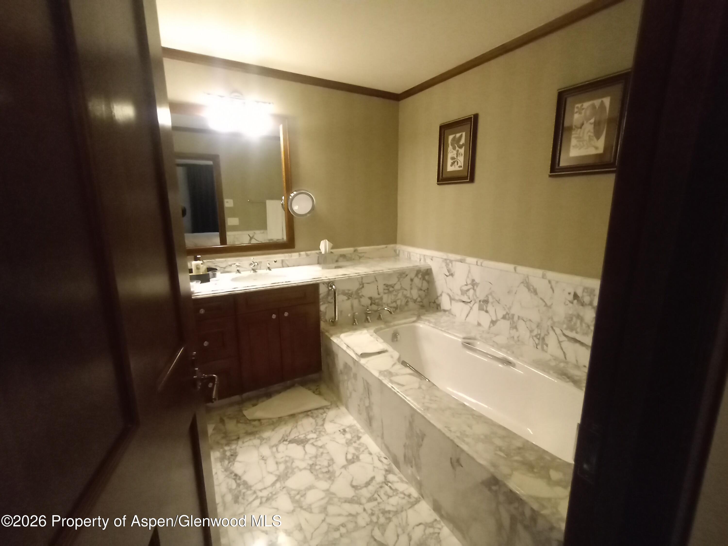 75 Prospector Road, Unit 8204 WINTER INTEREST #5 Aspen, CO 81611 - Photo 40 of 41 a bathroom with a sink and a mirror
