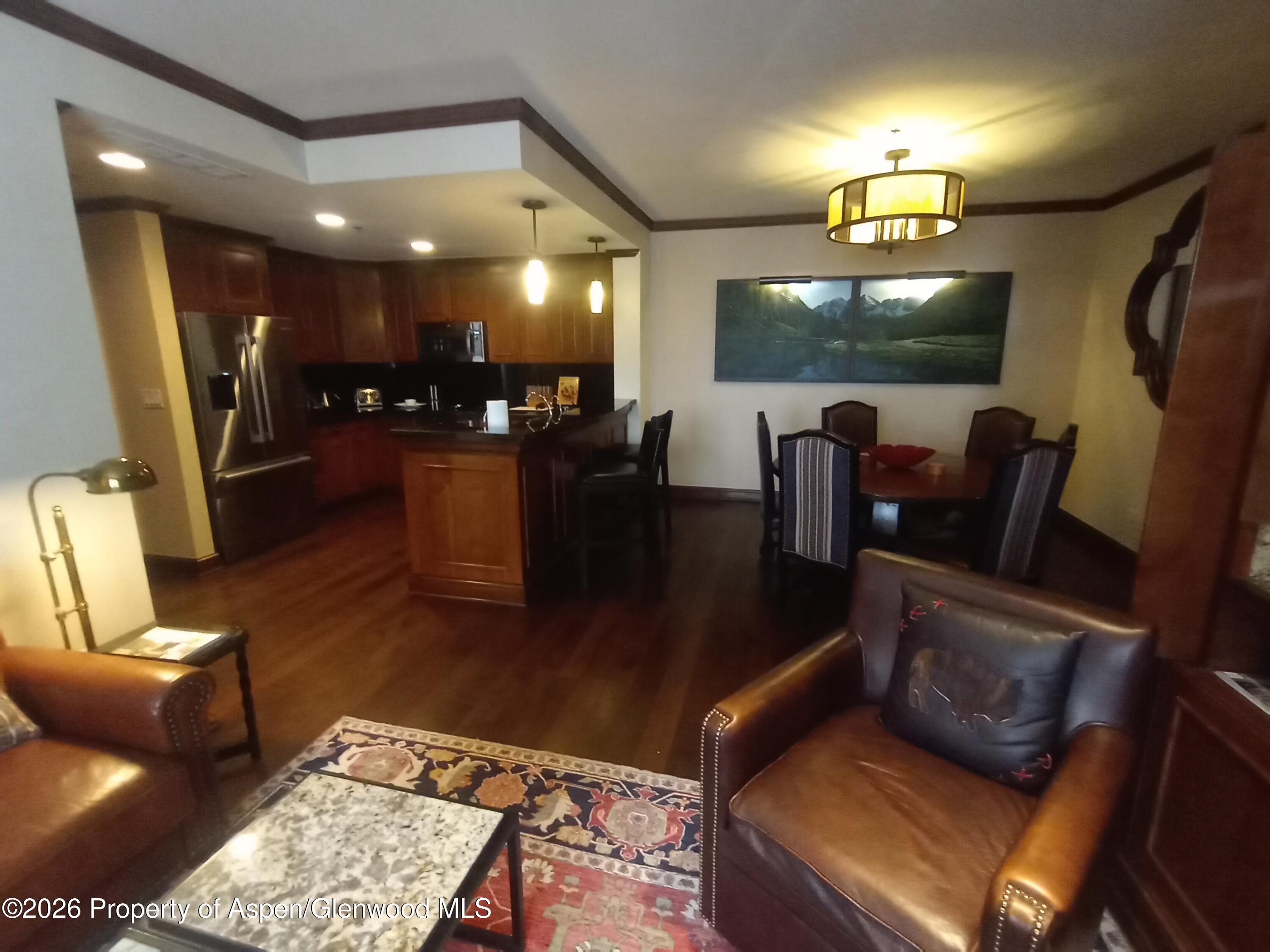 75 Prospector Road, Unit 8204 WINTER INTEREST #5 Aspen, CO 81611 - Photo 41 of 41 a living room with furniture and a flat screen tv