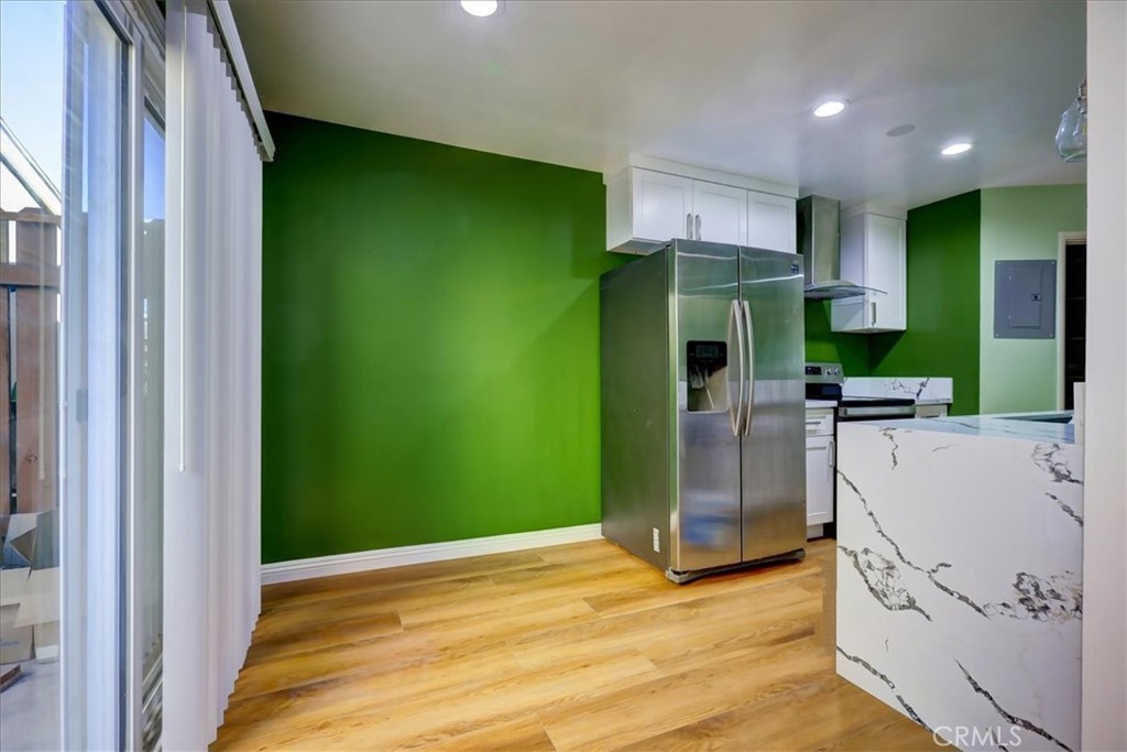 4723 Jackson Street, Unit 25 Riverside, CA 92503 - Photo 12 of 26 a view of a kitchen with a fridge and a sink
