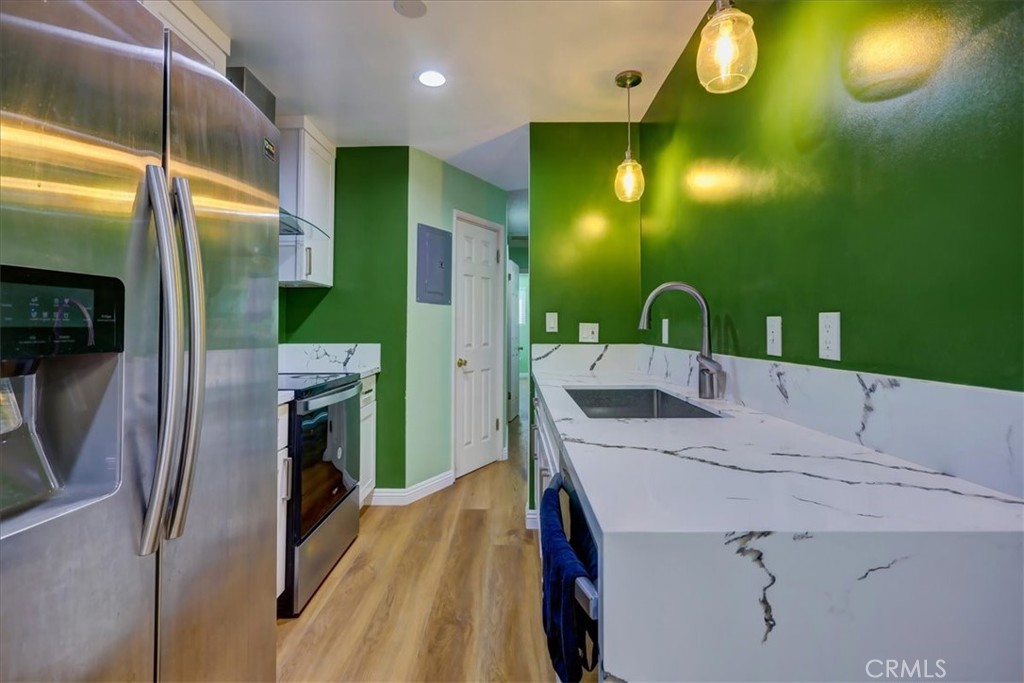 4723 Jackson Street, Unit 25 Riverside, CA 92503 - Photo 15 of 26 a bathroom with a sink mirror and vanity