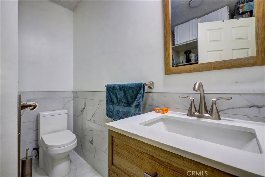4723 Jackson Street, Unit 25 Riverside, CA 92503 - Photo 19 of 26 a bathroom with a sink and a toilet