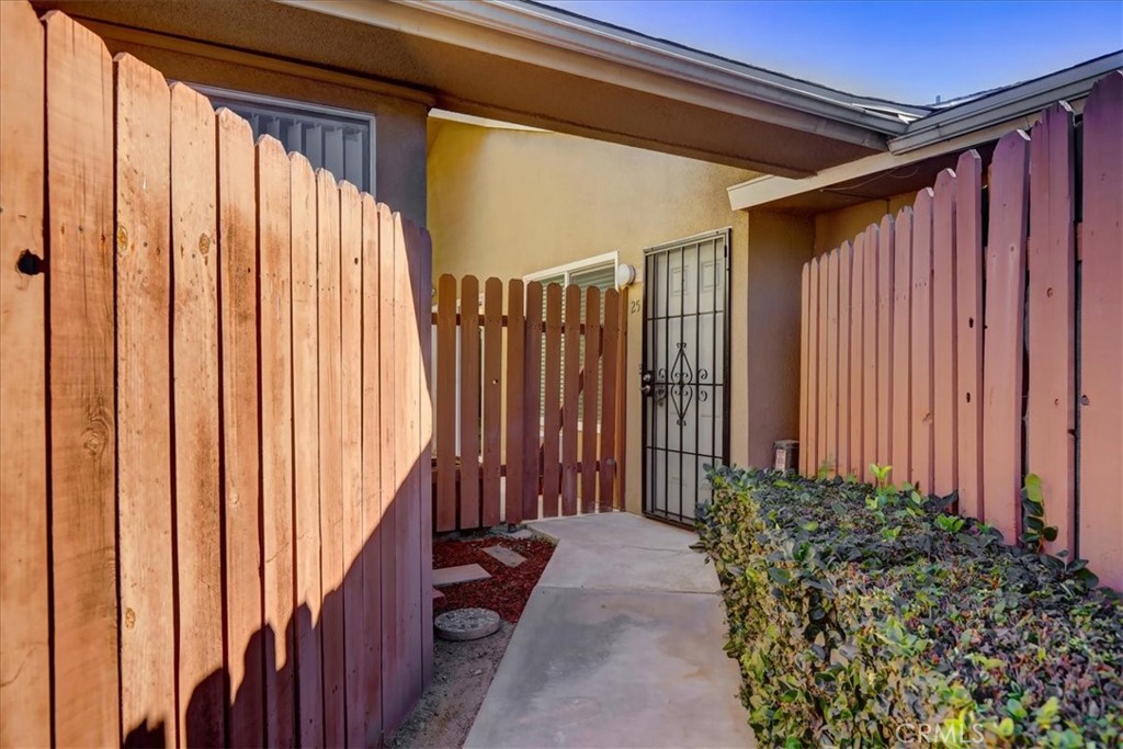 4723 Jackson Street, Unit 25 Riverside, CA 92503 - Photo 2 of 26 a view of a house with a potted plant and stairs