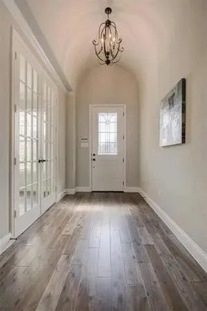 a kitchen with granite countertop a sink stainless steel appliances and cabinets