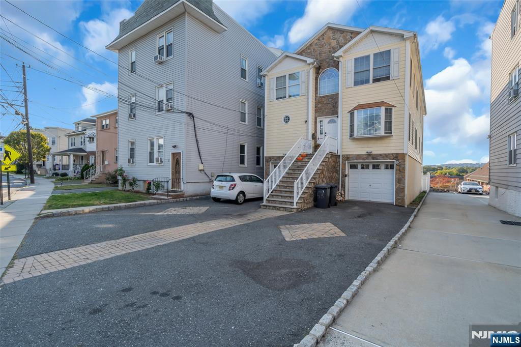 53 Passaic Avenue Nutley, NJ 07110 - Photo 40 of 42 a view of a city street with a building