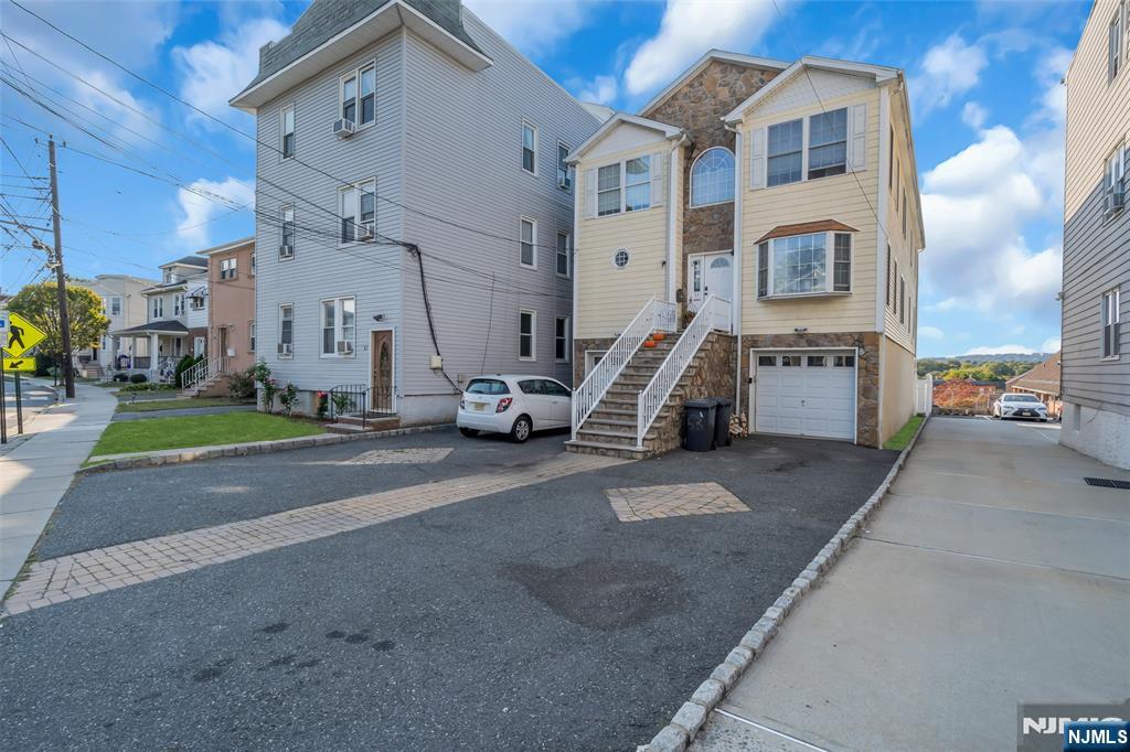 53 Passaic Avenue Nutley, NJ 07110 - Photo 6 of 42 a view of a street with cars