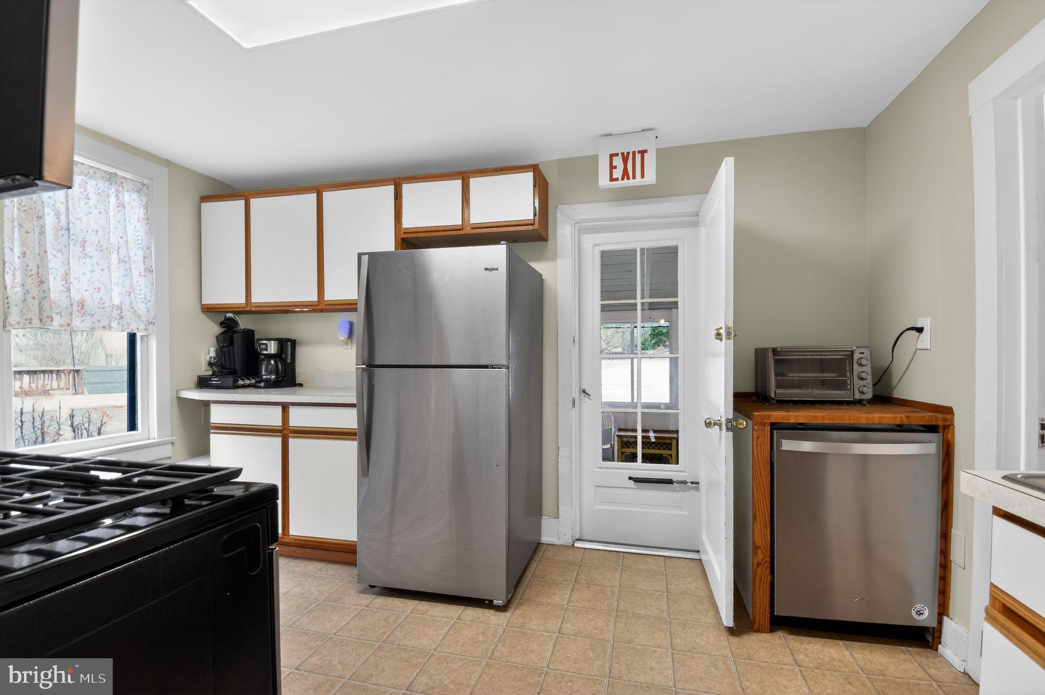 4041 7th Street North Beach, MD 20714 - Photo 12 of 35 a kitchen with a refrigerator stove and sink
