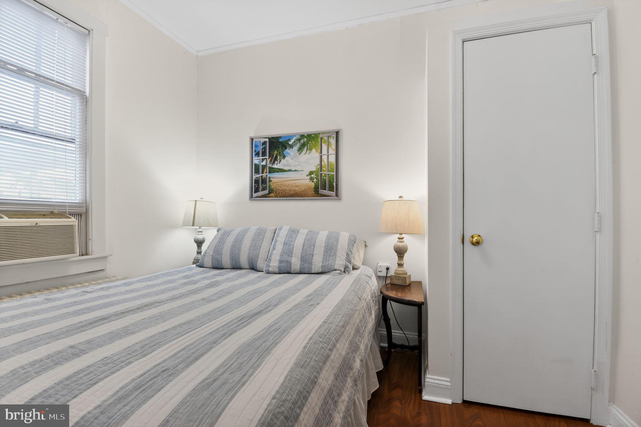 4041 7th Street North Beach, MD 20714 - Photo 17 of 35 a bedroom with a bed and a window