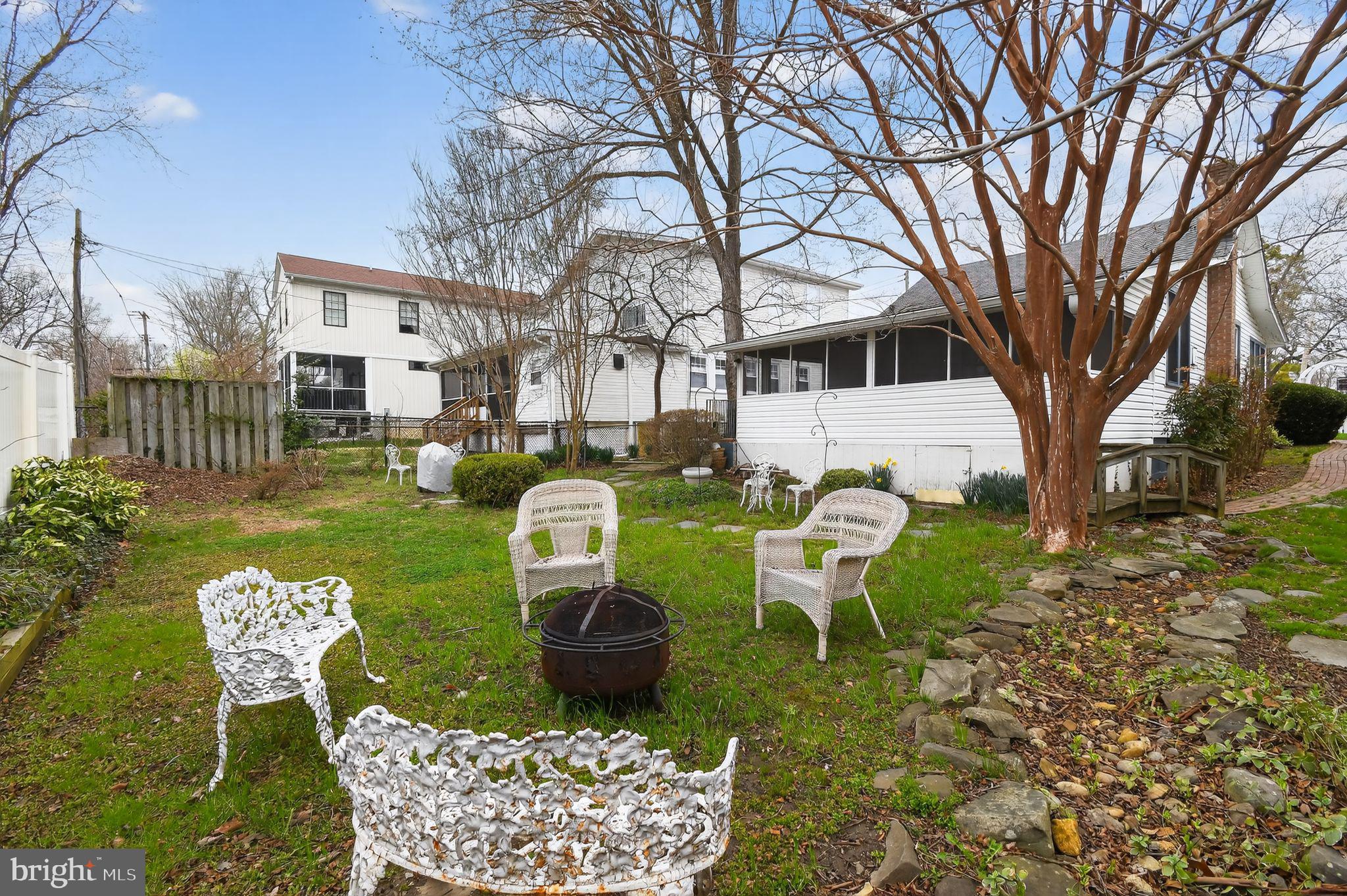 4041 7th Street North Beach, MD 20714 - Photo 26 of 35 a view of a chairs and table in backyard