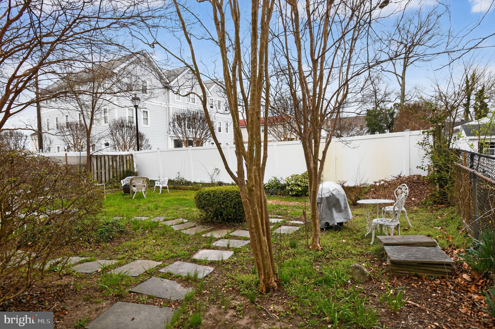 4041 7th Street North Beach, MD 20714 - Photo 28 of 35 a view of backyard with table and chairs and a large tree