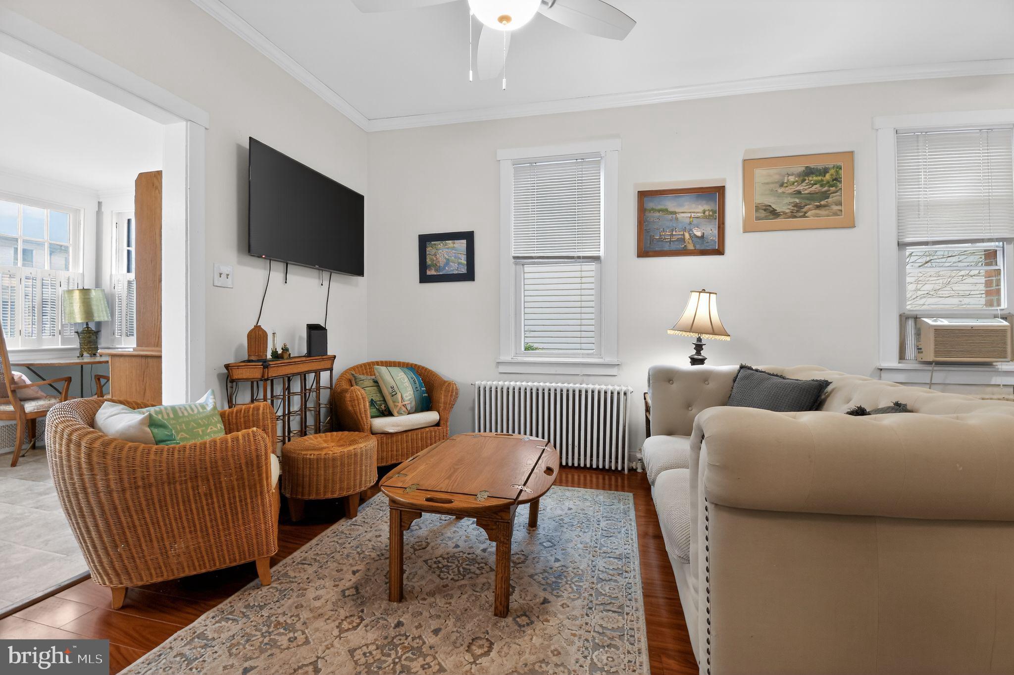 4041 7th Street North Beach, MD 20714 - Photo 7 of 35 a living room with furniture and a flat screen tv