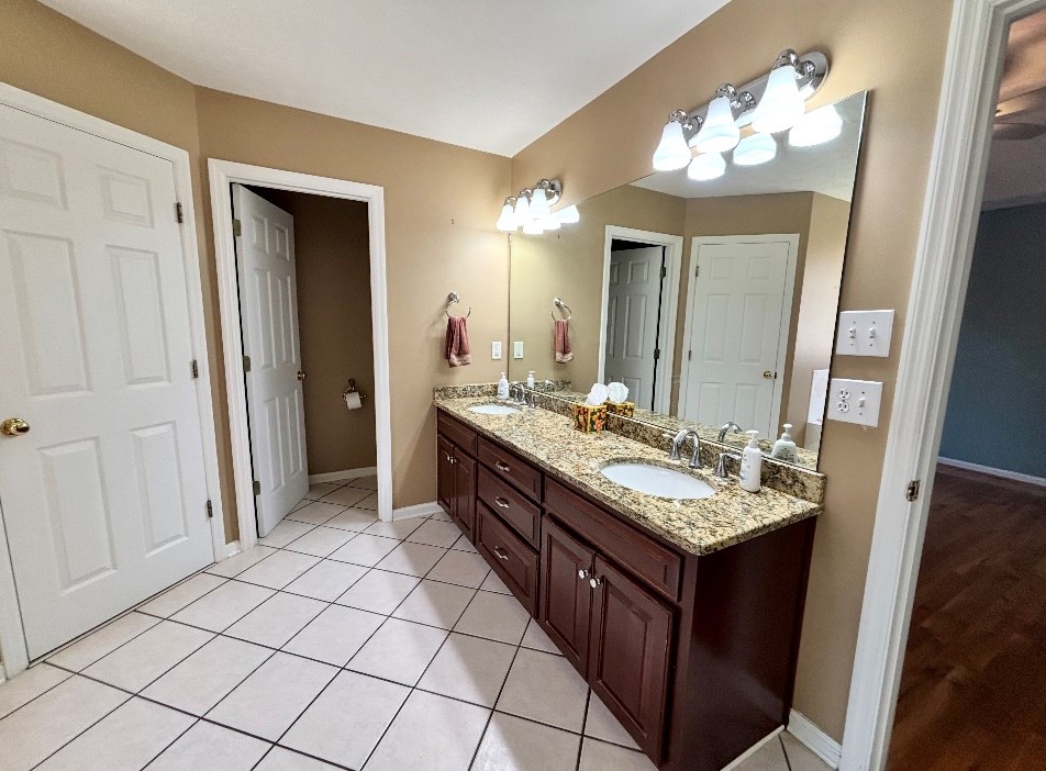 205 Morton Court Fortson, GA 31808 - Photo 12 of 23 a bathroom with a sink vanity and a mirror