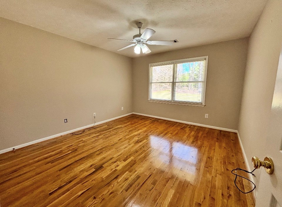 205 Morton Court Fortson, GA 31808 - Photo 17 of 23 a view of a room with wooden floor and a window