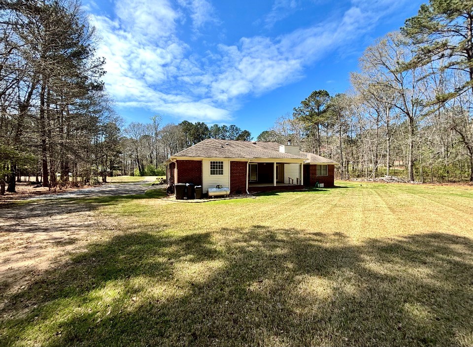 205 Morton Court Fortson, GA 31808 - Photo 21 of 23 a front view of a house with a garden