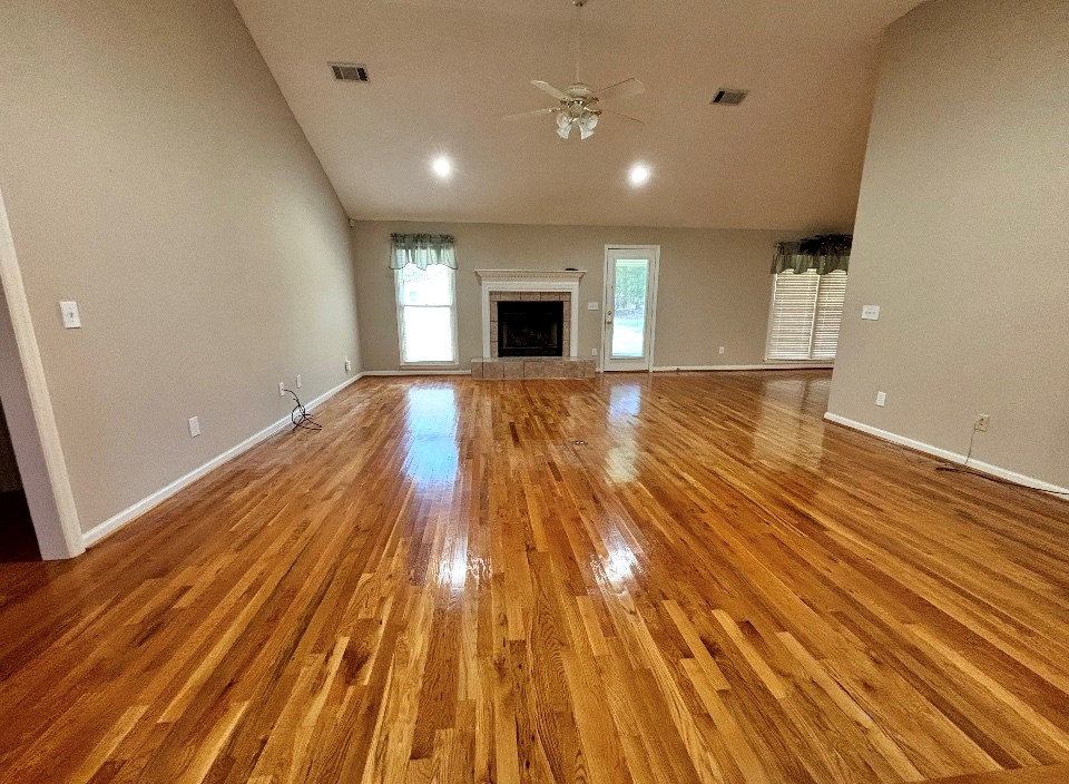 205 Morton Court Fortson, GA 31808 - Photo 4 of 23 a view of empty room with wooden floor and fireplace