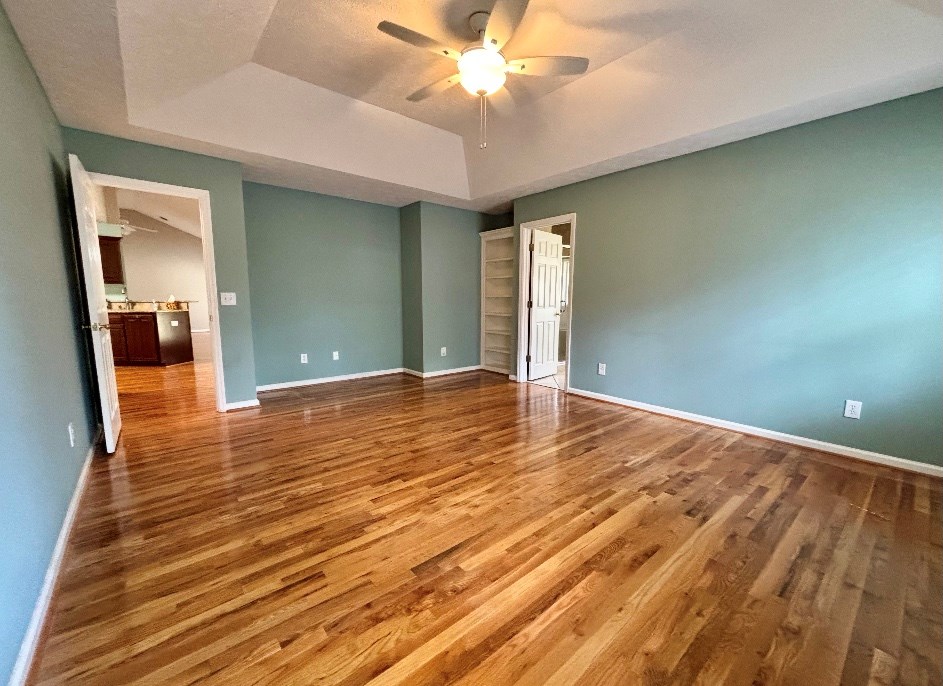 205 Morton Court Fortson, GA 31808 - Photo 9 of 23 wooden floor in an empty room with a window