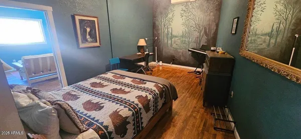 a bed sitting in a bedroom next to a window
