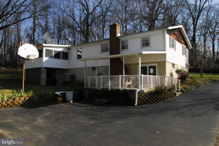 2616 Reckord Road Fallston, MD 21047 - Photo 14 of 30 Exterior Rear with Enclosed Deck & Covered Porch