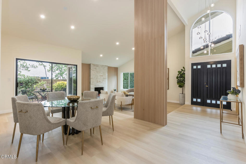 11772 Monte Leon Way Porter Ranch, CA 91326 - Photo 15 of 58 a view of a dining room with furniture window and wooden floor