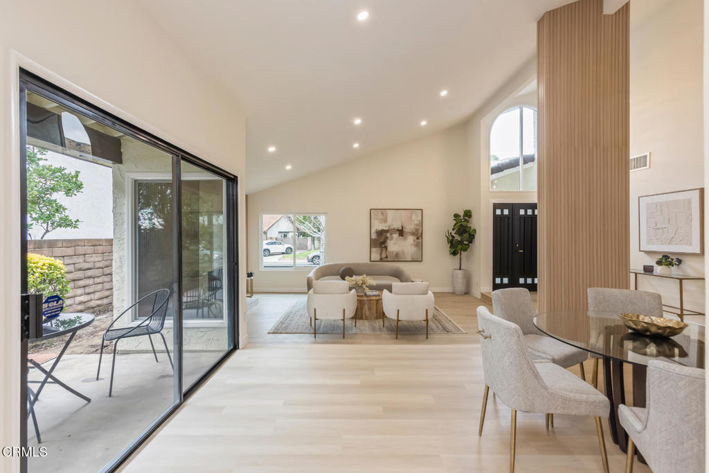 11772 Monte Leon Way Porter Ranch, CA 91326 - Photo 16 of 58 a view of a dining room with furniture next to a large window