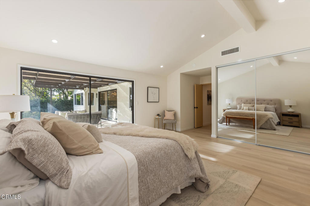 11772 Monte Leon Way Porter Ranch, CA 91326 - Photo 33 of 58 a spacious bedroom with a large bed and a large window