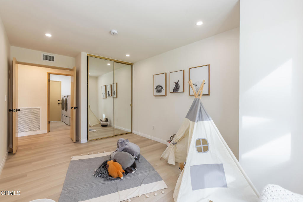11772 Monte Leon Way Porter Ranch, CA 91326 - Photo 40 of 58 a living room with furniture and wooden floor