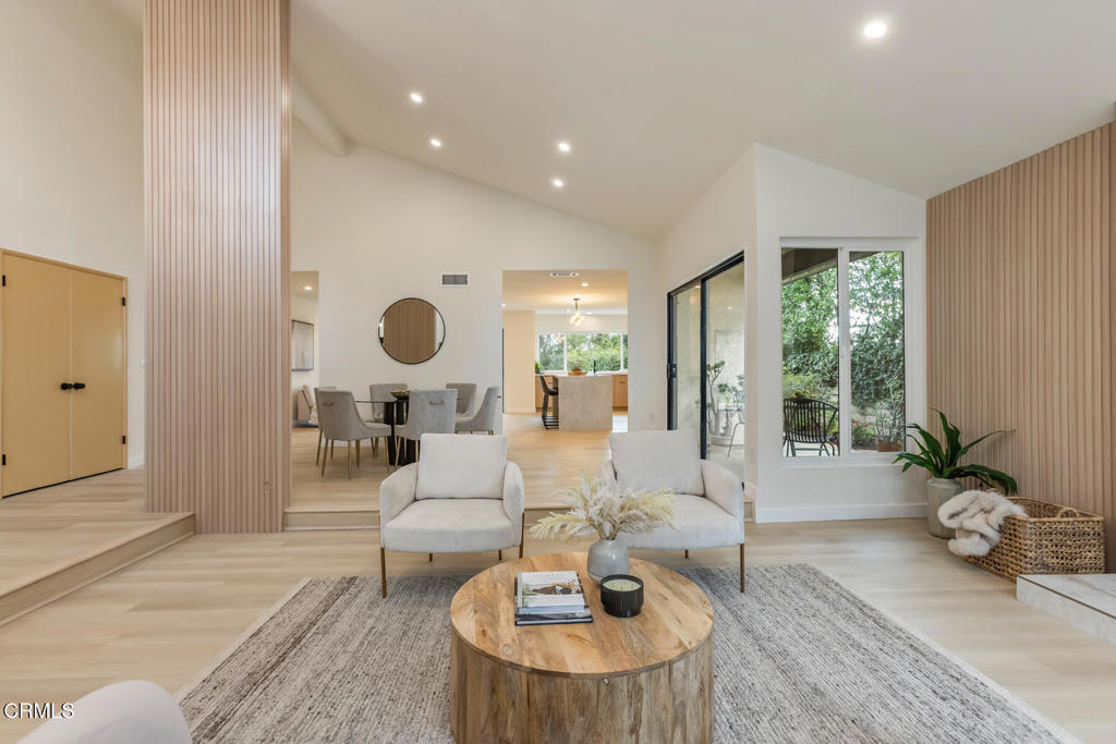 11772 Monte Leon Way Porter Ranch, CA 91326 - Photo 8 of 58 a living room with furniture potted plant and large windows